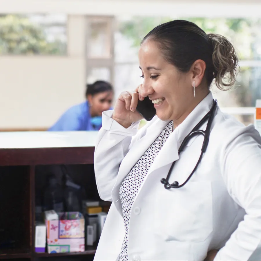 woman doctor on phone with patient
