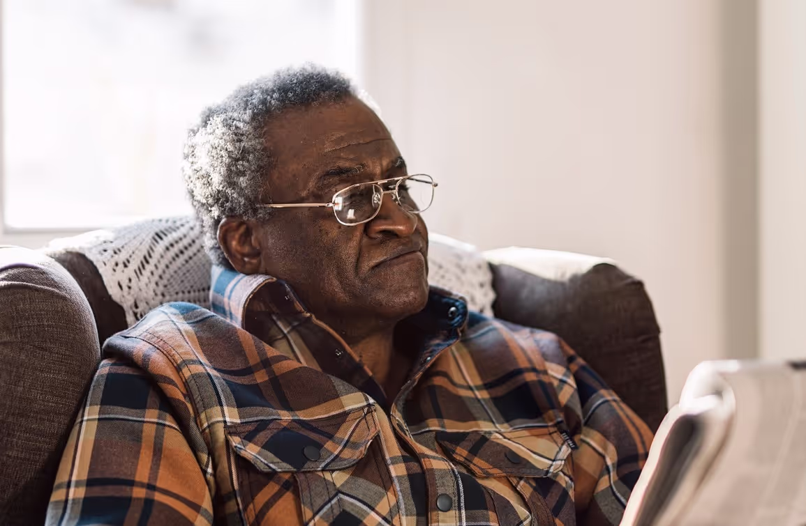 Older man reading the newspaper