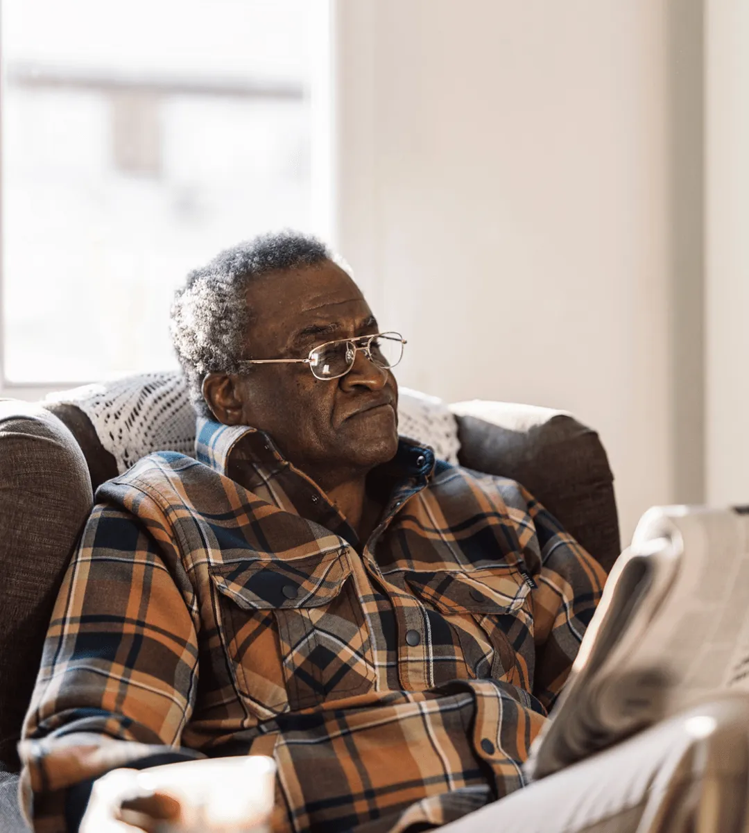 Old gentleman reads newspaper