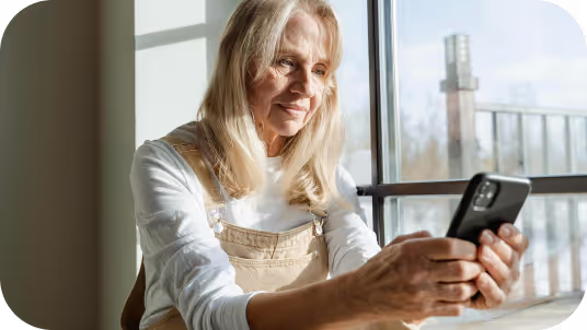 Woman at window on phone