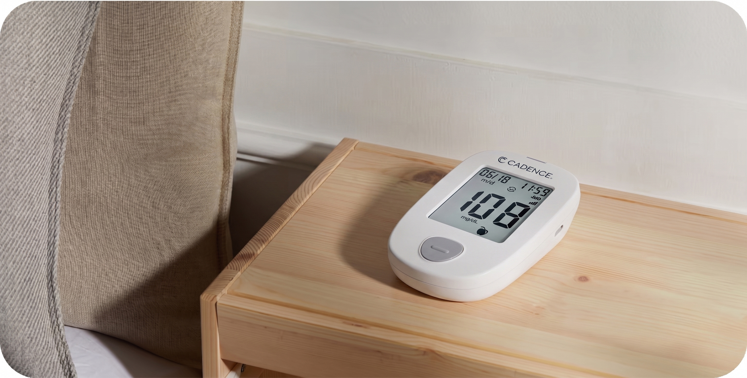 Cadence blood glucose monitor on a bedside table